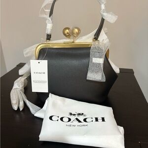 New and Authentic Coach Kisslock Frame 16 Black and Gold Bag with chain